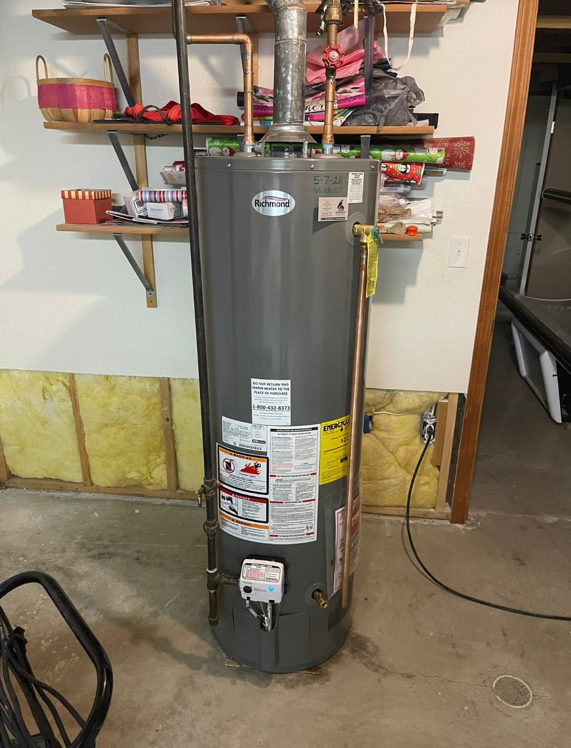 Natural gas tank water heater installation with proper venting